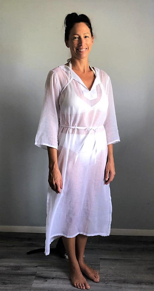 A woven cotton voile tunic dress in white. Available in aqua, coral and white.