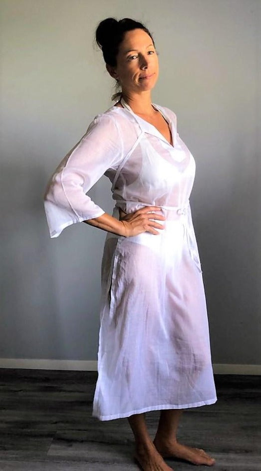 A woven cotton voile tunic dress in white. Available in aqua, coral and white.