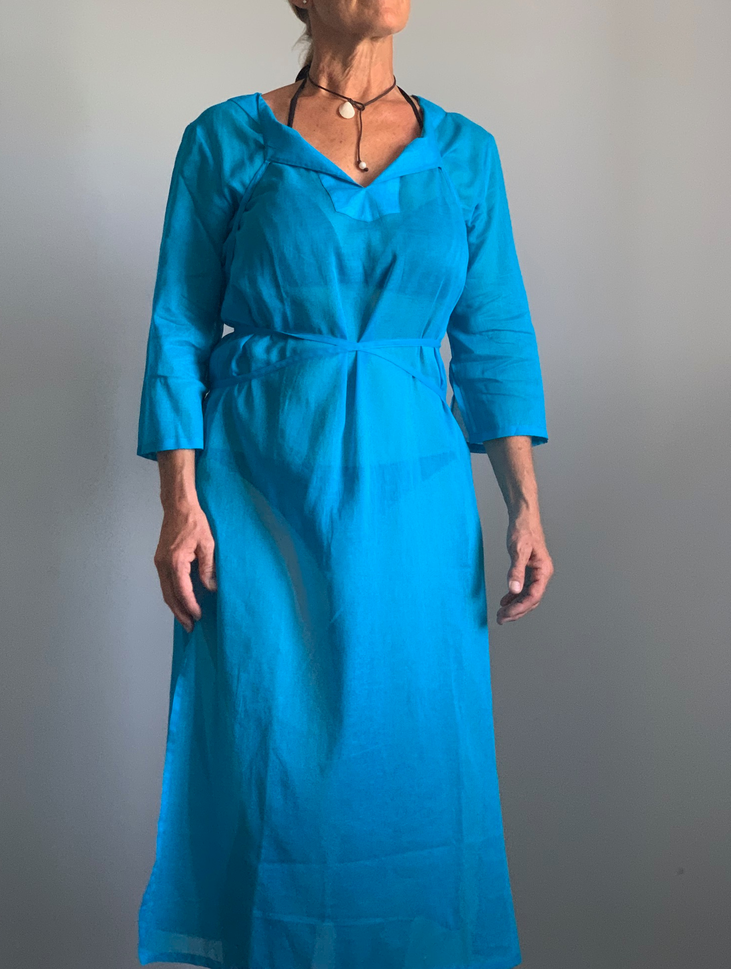 A woven cotton voile tunic dress in Antiguan Blue